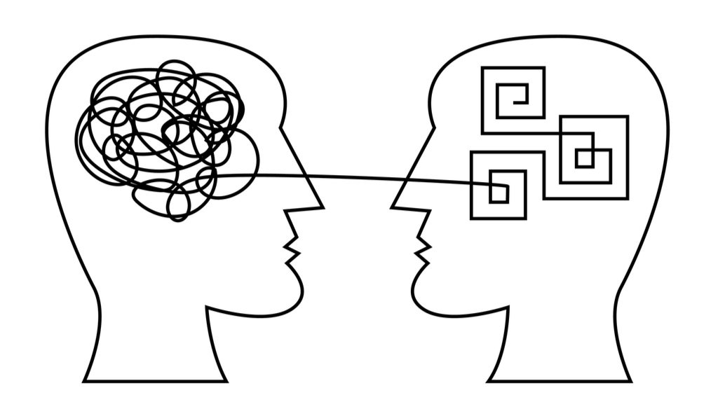 Line drawing of information exchange between two human heads.